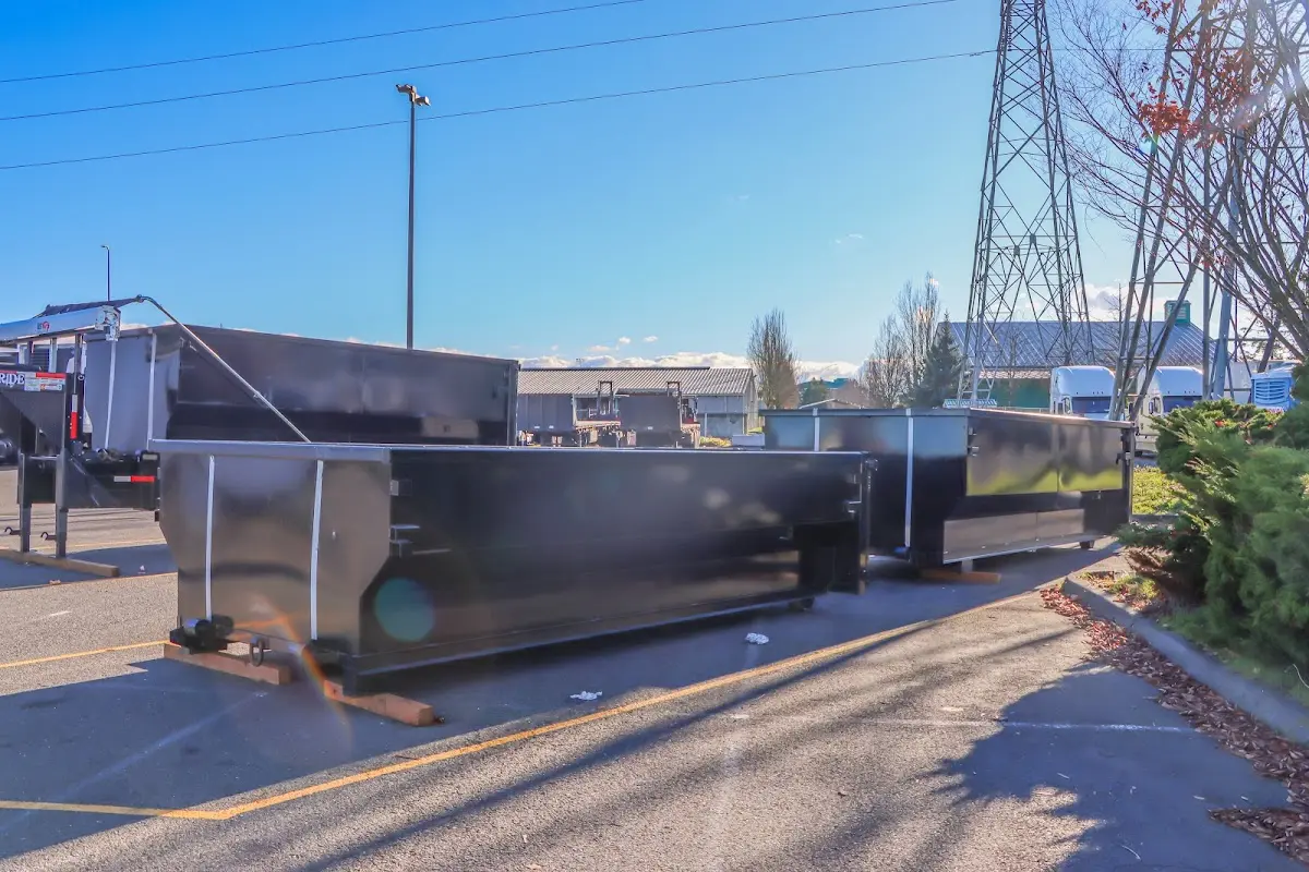 Roll-off dumpster ready for waste disposal at job site for 15 Yard Dumpster Rental in Paris